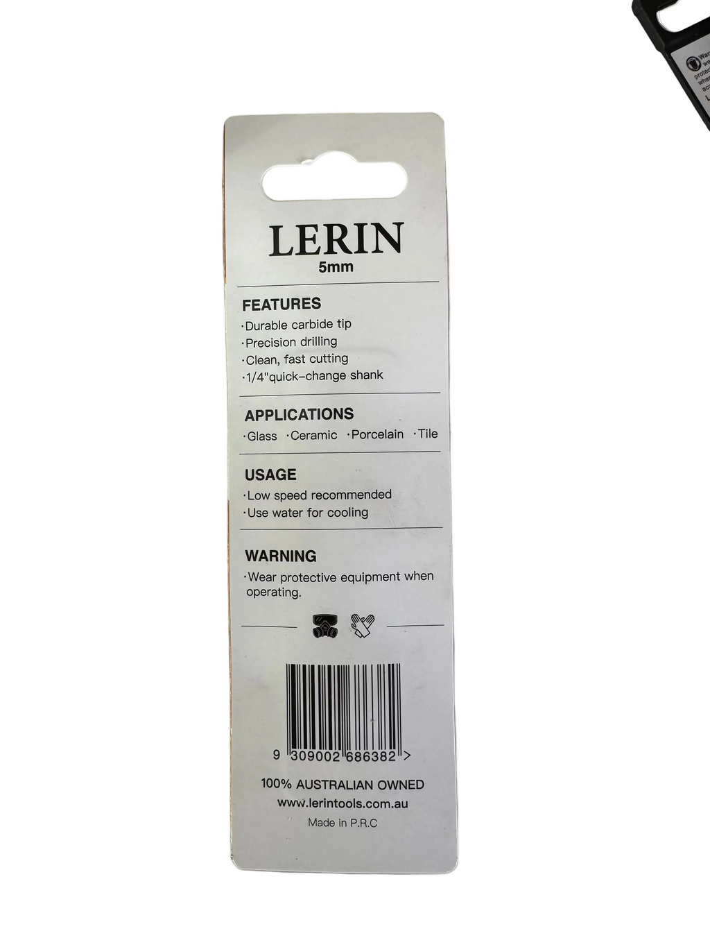 A white plastic retail hang card for a LERIN 5mm precision carbide tip, showing product features, applications, usage instructions, and a barcode on a light gray workbench surface.