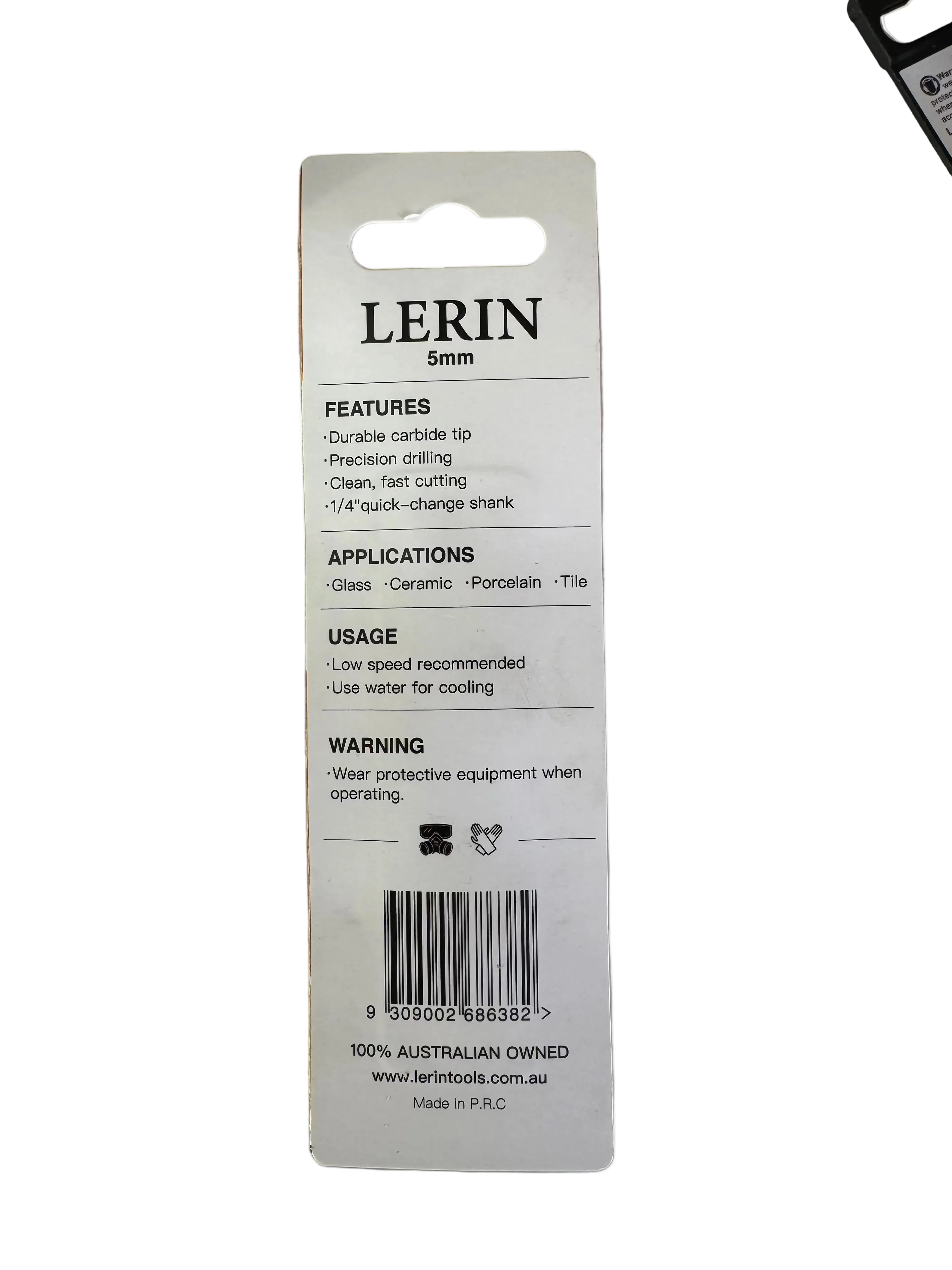 A white plastic retail hang card for a LERIN 5mm precision carbide tip, showing product features, applications, usage instructions, and a barcode on a light gray workbench surface.